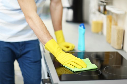 Cleaner maintaining a kitchen during a recurring Hampstead cleaning visit